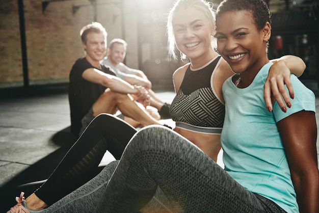 two smiling women sitting gym after working out 1326977 2699